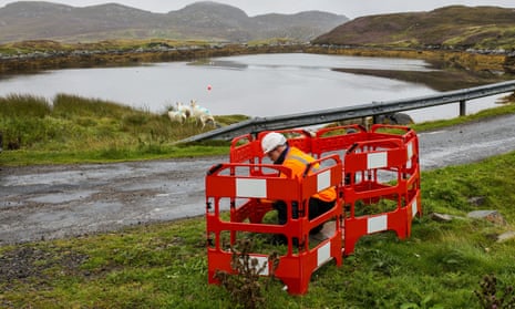 An engineer works on a full-fibre broadband link on Grimsay, Outer Hebrides
