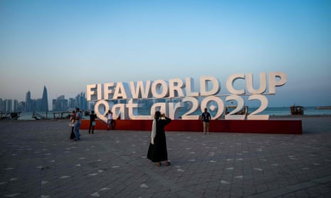 Visitors take photos with a Fifa World Cup sign in Doha.