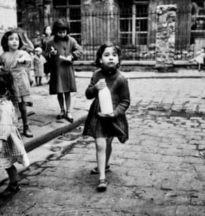 Girl with milk bottle, Cité Lesage-Bullourde, Paris, c1950