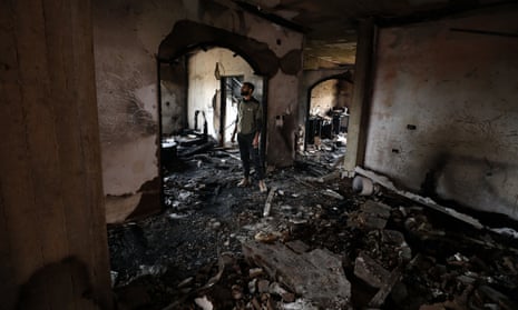 A Palestinian man inspects a destroyed house after the Israeli army burned it during its raid on Jenin.