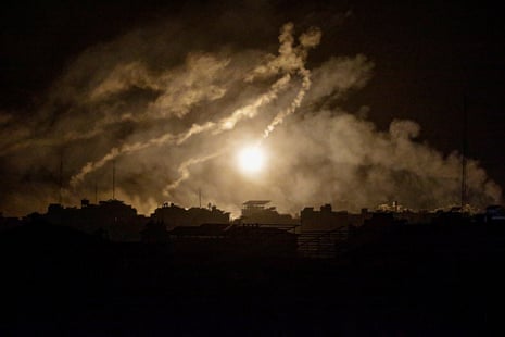Israeli army flares illuminate the sky over west Gaza amid increased military operations in the west northern Gaza Strip