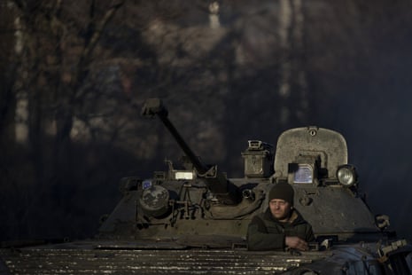 Armoured military vehicles travel through Donetsk.