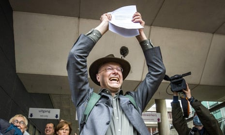 Donald Pols, director of Milieudefensie, celebrates after the ruling in The Hague.