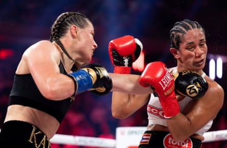 Katie Taylor punches Amanda Serrano in their undisputed IBF, WBA, WBC, WBO, and Ring super lightweight championship bout.