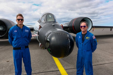 Cary Klemm, sensor equipment operator, and pilot John Gustine of NASA’s Johnson Space Center, pose in front of a WB-57 Canberra aircraft