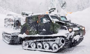 German soldiers use armoured vehicles to reach people trapped by heavy snow in Berchtesgaden