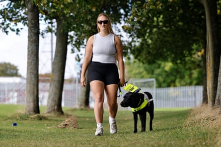 Gough walking with her guide dog Helga.