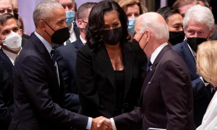 Joe Biden greets Barack Obama and former First Lady Michelle Obama at Madeleine Albright’s funeral, watched by former president Bill Clinton (right), who appointed Albright the nation’s first female secratry of state in 1997.