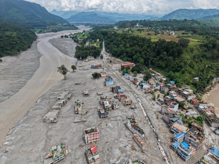 An aerial photo shows houses along the Trishuli River destroyed by the floods