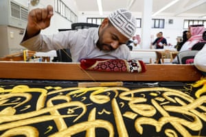 Mecca, Saudi Arabia. A worker prepares the Kiswa, a silk cloth that covers the Kaaba, the sacred building at the centre of the Grand Mosque, ahead of the annual haj pilgrimage, at a factory in the city