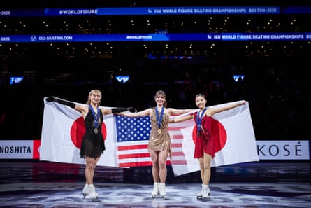 Kaori Sakamoto of Japan, left, Alysa Liu of United States, center, and Mone Chiba of Japan pose after Friday’s medal ceremony.