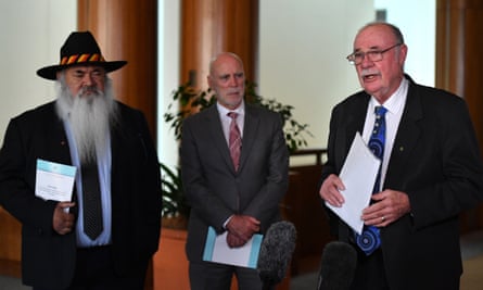 Labor senator Pat Dodson, Labor MP Warren Snowdon and Liberal MP Warren Entsch unveil the interim report into the destruction of Indigenous heritage sites