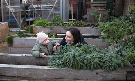 Georgina and her daughter Olive explore Manor Park community garden in Newham