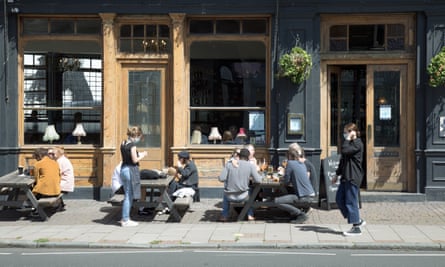 Customers at the East Dulwich Tavern in south London on 5 July, the day after pubs in England were allowed to reopen.
