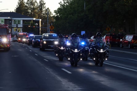 A procession from Kootenai Health on its way to Spokane after a firefighters were killed in the shooting incident.