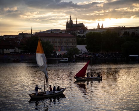 Boats cruise the Vltava river during the Navalis celebrations, with Prague Castle in the background, in Prague, Czech Republic.