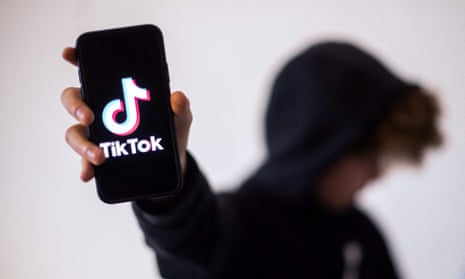 File photo of a teenager showing a smartphone with the logo of social network TikTok