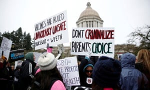 People opposed to compulsory vaccination participate in the "March for Freedom of Medicine" in front of the Legislative Building in Olympia, the capital of Washington State.