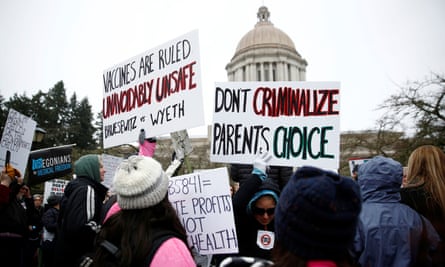 People against mandatory vaccinations participate in the ‘March for Medical Freedom’ outside the Legislative Building in Olympia, the capital of Washington state.