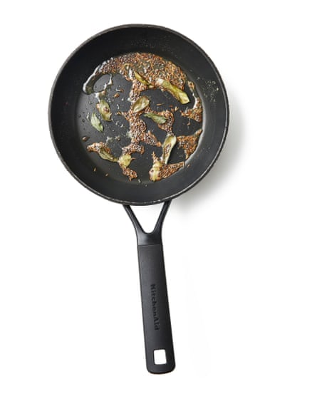 Tempering with oil with the spices.