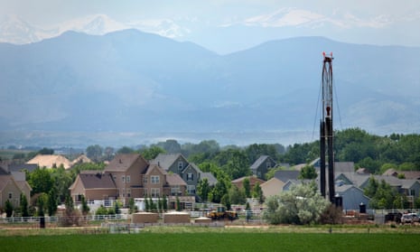 Just off Interstate Highway 25, a fracking drill rig looms over homes in Weld County, Colorado.