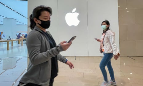 People at an Apple retail store in Taipei, Taiwan.