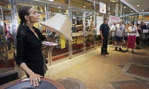 Joann Barberio of Aberdeen, New Jersey buys a lamp and table for a pool.