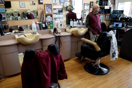 Owner Pino D’erasmo, the Owner of Pino’s Hair Salon looks out from his empty shop during the coronavirus outbreak on North Avenue in New Rochelle.