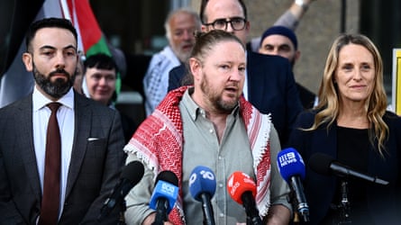 Josh Lees of Palestine Action Group (centre) speaks to media outside the NSW supreme court on 16 April after anti-protest powers rolled out after the Bondi massacre were struck down.