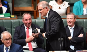 Scott Morrison hands Barnaby Joyce a lump of coal during question time in the House of Representatives in February 2017.