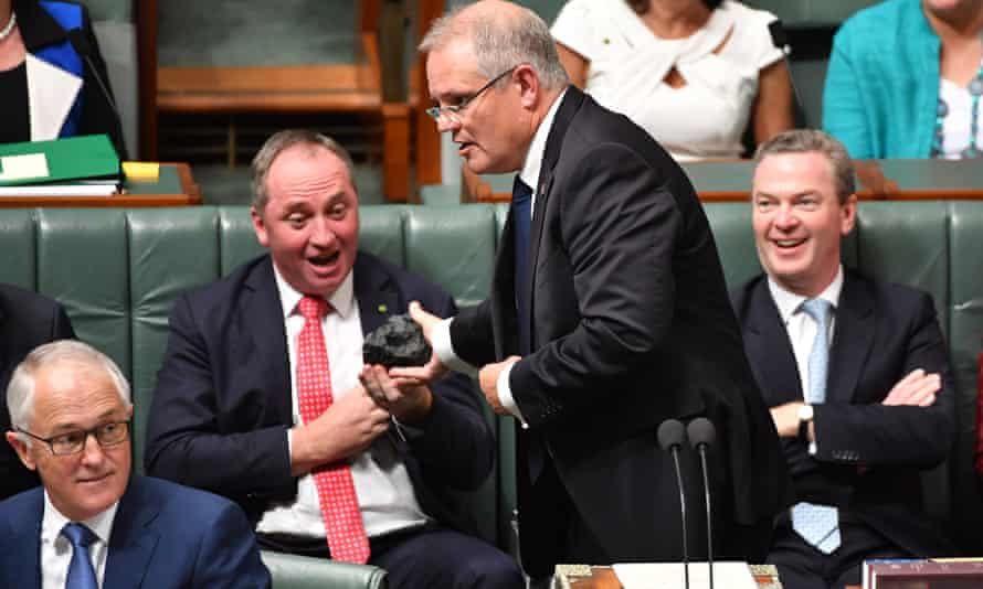 Scott Morrison hands Barnaby Joyce a lump of coal during Question Time in parliament