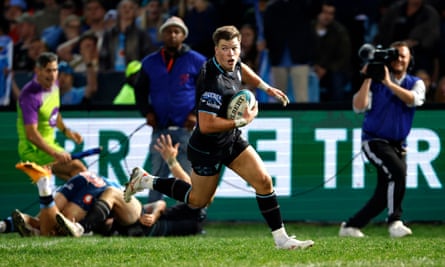 Huw Jones runs scores a try for Glasgow Warriors against the Bulls.
