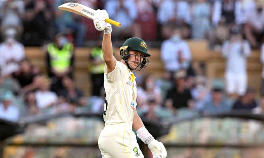 Australian batsman Marnus Labuschagne raises his bat after reaching a half century on day one of the second Ashes Test.