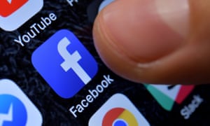 A close-up image showing the Facebook app on an iPhone