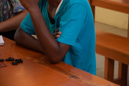 An anonymised picture of a child sat at a table