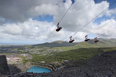 Four parallel zip lines high above the Welsh countryside
