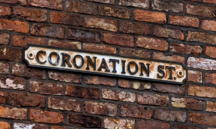 The Coronation Street road sign on a brick wall