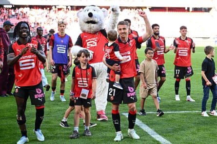Valentin Rongier (centre) and Rennes’ players celebrate victory over Nantes