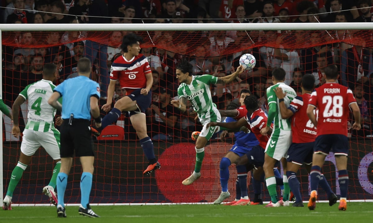 Marc Bartra celebrates scoring for Real Betis against Lille