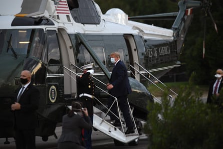 Donald Trump leaves Walter Reed medical center in Bethesda, Maryland, on 5 October.