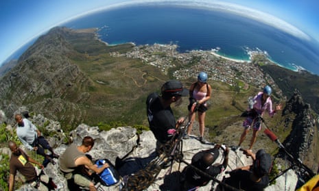 Travellers abseiling down Table Mountain in Cape Town, South Africa. TRV