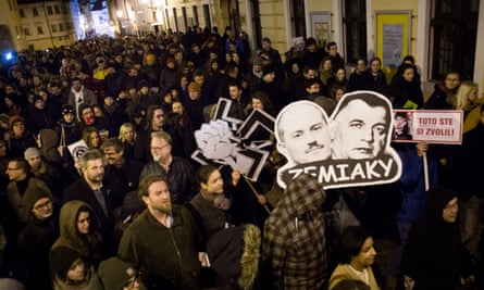 The faces of Kotleba and Jozef Tiso carried during an anti-extreme right rally in Bratislava.