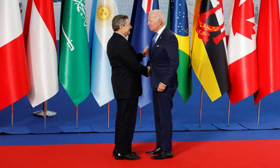Italy's prime minister, Mario Draghi, greets the US president, Joe Biden, at the G20 leaders' summit in Rome.