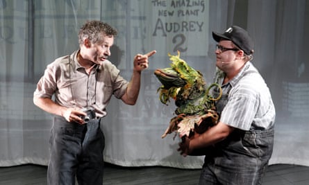 Mr Mushnik (Tyler Coppin), Seymour (Brent Hill) and Audrey II in Little Shop of Horrors