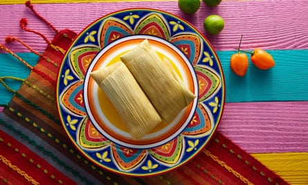 Mexican Tamale tamales of corn leaves with chili and sauces.