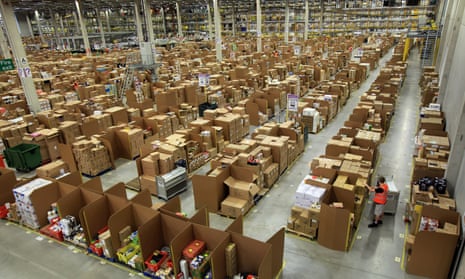 A worker collects items for delivery at Amazon’s Swansea warehouse