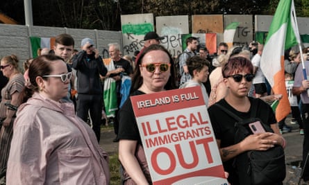 Protest against a site earmarked for migrants in Dublin, Ireland – 19 Jul 2024Mandatory Credit: Photo by Natalia Campos/SOPA Images/REX/Shutterstock (14595372g) Anti-immigration protesters rally in front of the former Crown Paints site during the demonstration. A second protest took place in Coolock, north Dublin, on Friday evening. People continue to protest against the reopening of the former Crown Paints site, which is intended to house migrants,