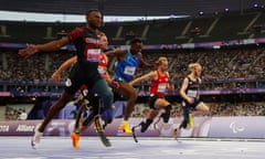 Sherman Guity Guity celebrates as he wins gold in the T64 100m.