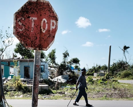 A man walks in Cordington, Barbuda, after Hurricane Irma hit the island in 2017.