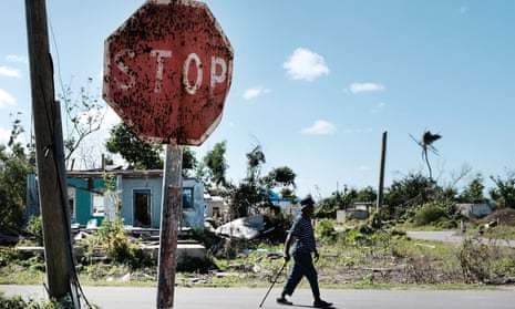 A man walks in Cordington, Barbuda, after Hurricane Irma hit the island in 2017.